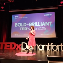 Me on stage at the 2019 TEDxWomen event I co-organised and hosted